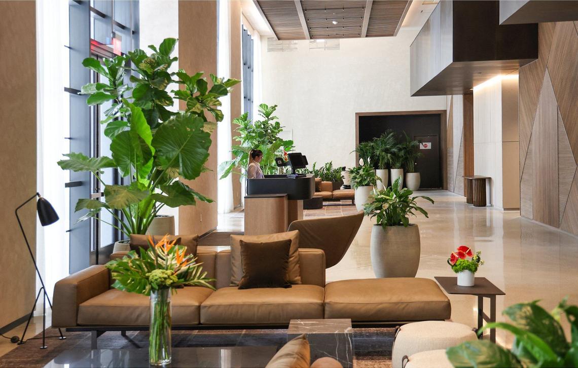 Macarena Vargas works the front desk inside the lobby of the Gale Miami Hotel & Residences that is opening soon. The Gale Hotel and Residence gave a preview of its property along with amenities during a tour on Thursday, May 16, 2024 in Miami, Florida.