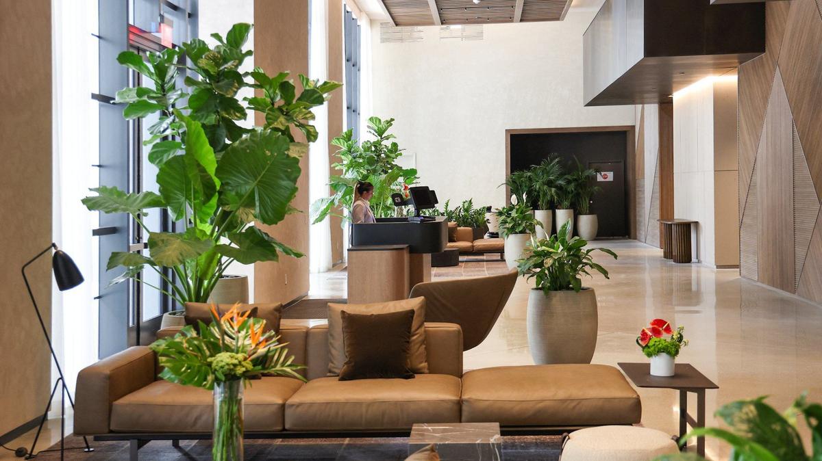 Macarena Vargas works the front desk inside the lobby of the Gale Miami Hotel & Residences that is opening soon. The Gale Hotel and Residence gave a preview of its property along with amenities during a tour on Thursday, May 16, 2024 in Miami, Florida.