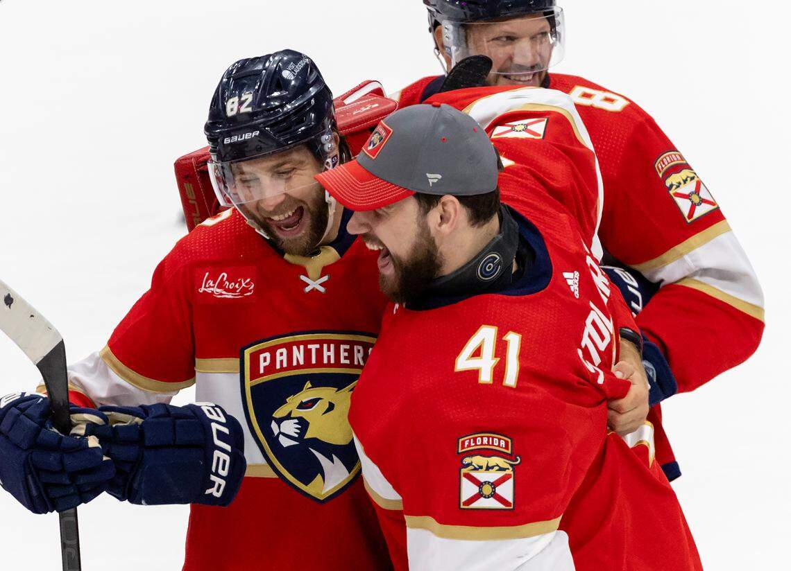 Florida Panthers players Kevin Stenlund (82) Anthony Stolarz (41) and Kyle Okposo (8) celebrates after their team’s win against the New York Rangers in Game 6 during the Eastern Conference finals of the NHL hockey Stanley Cup playoffs at the Amerant Bank Arena on Saturday, June 1, 2024, in Sunrise, Fla.
