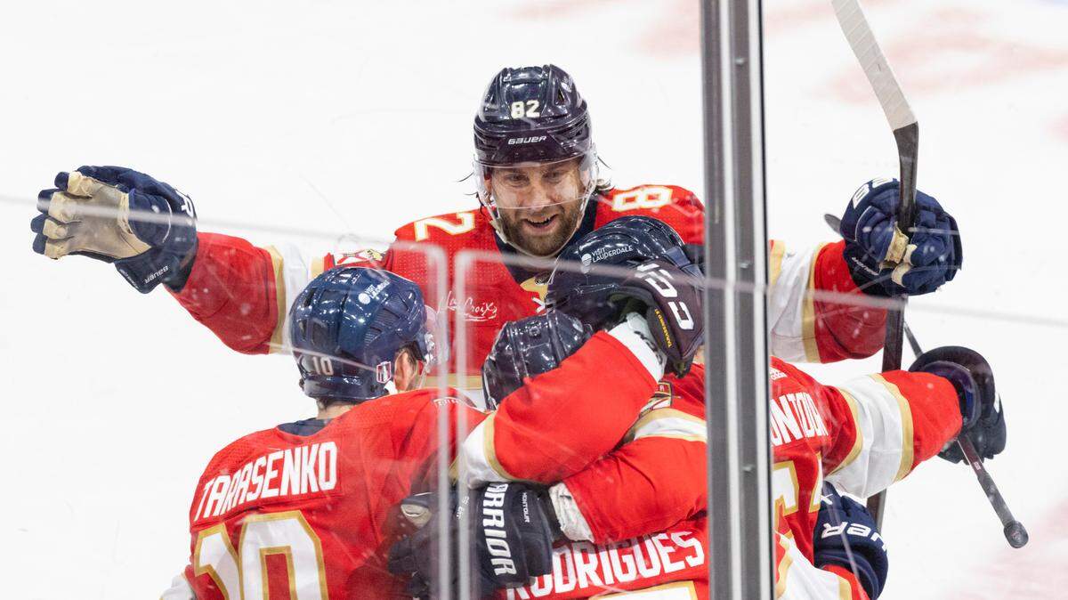 Florida Panthers center Kevin Stenlund (82) celebrates a goal by Florida Panthers center Evan Rodrigues (17) during the third period of Game 5 of Round 1 of the Stanley Cup Playoffs on Monday, April 29, 2024, at Amerant Bank Arena in Sunrise, Fla. The Florida Panthers won 6-1 and won the series.