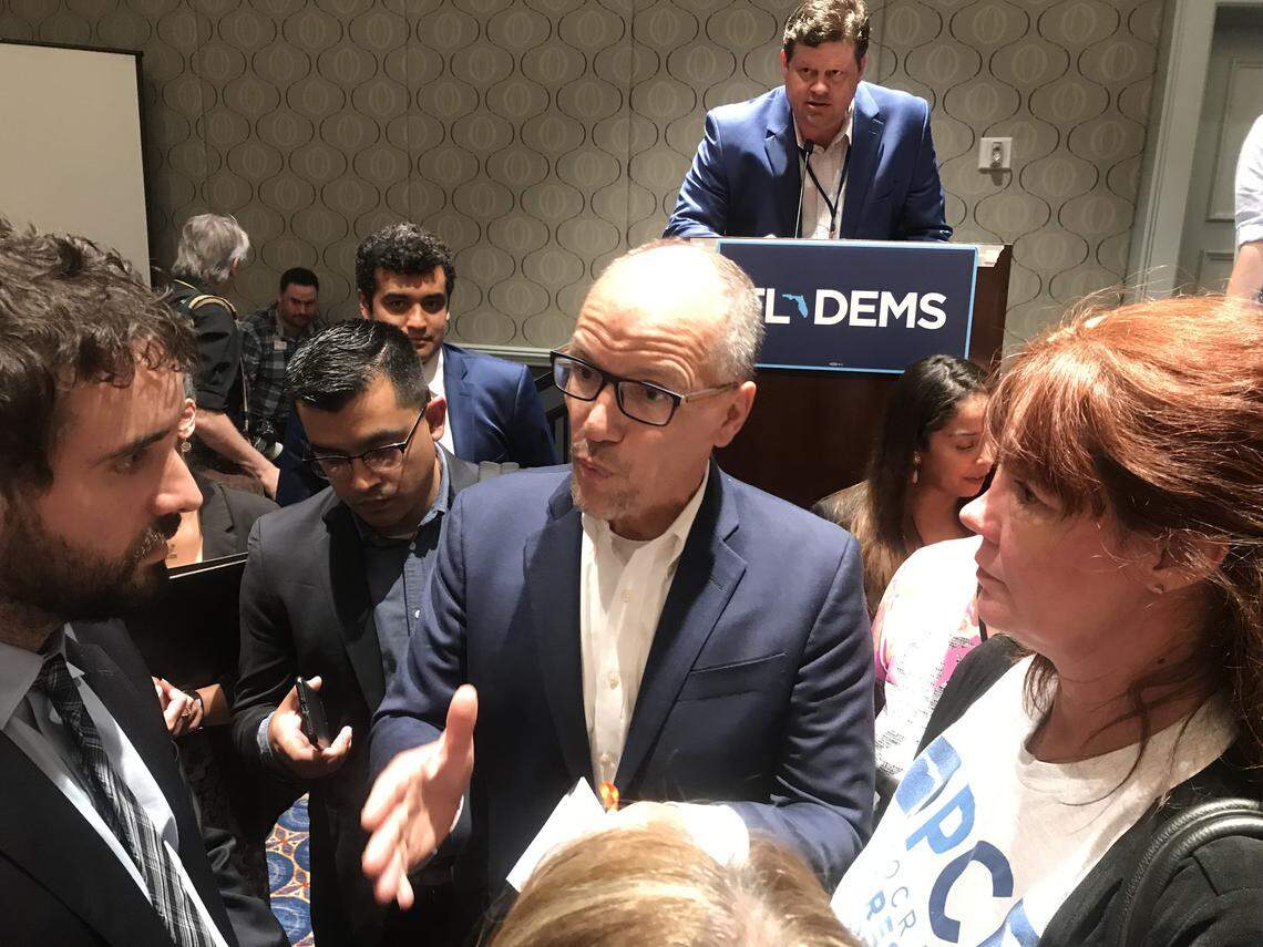 Democratic National Committee Chairman Tom Perez (center) answers questions about 2020 primary debates from Miami activist Thomas Kennedy (left) following a speech during the Florida Democratic Party’s annual summer conference, at Disney World in Orlando.