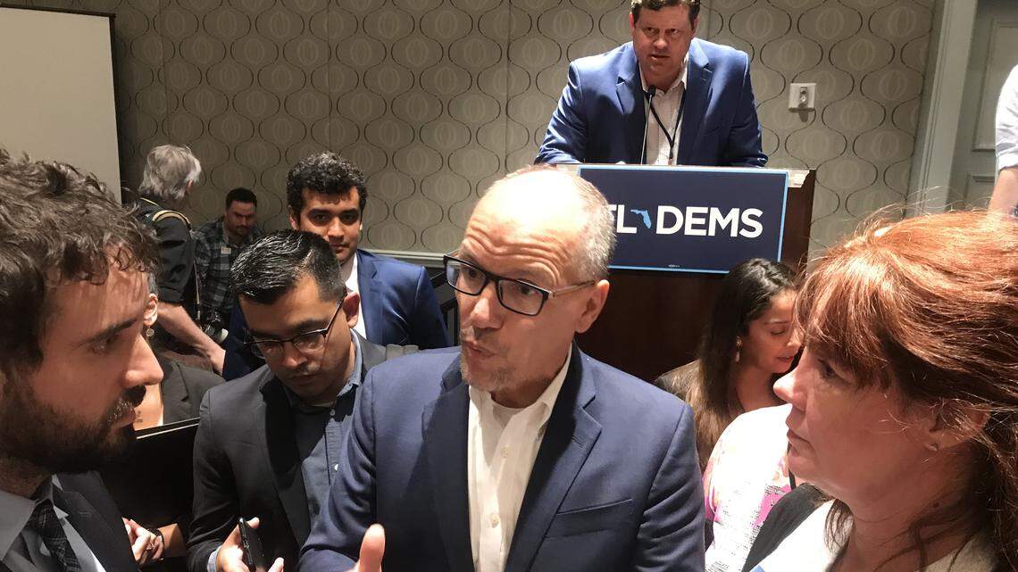 Democratic National Committee Chairman Tom Perez, center, answers questions about 2020 primary debates from Miami activist Thomas Kennedy, left, following a speech during the Florida Democratic Party’s annual summer conference, at Disney World in Orlando.