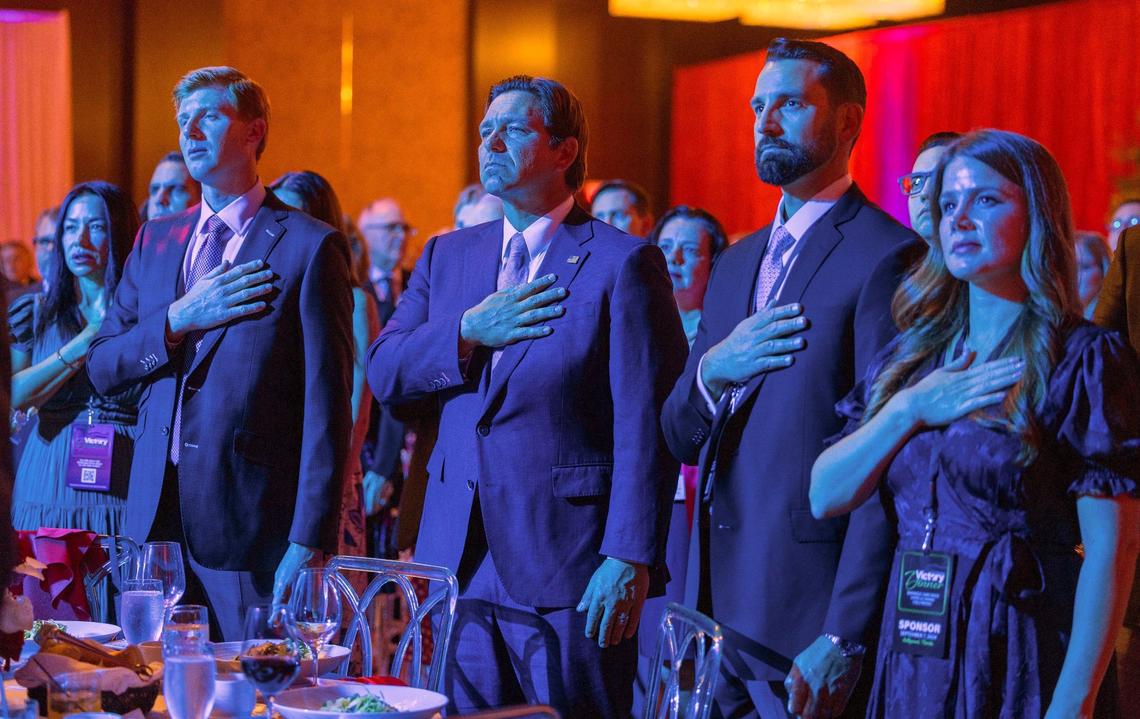 Florida Governor Ron DeSantis stands up during the pledge of allegiance at the Republican Party of Florida’s 2024 Victory Dinner, at the Seminole Hard Rock Hotel & Casino in Hollywood, Florida on Saturday, September 07, 2024.