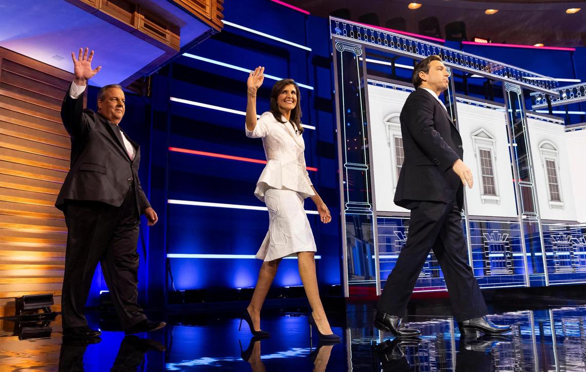 From left to right: Former Gov. Chris Christie of New Jersey, former U.N. Ambassador Nikki Haley and Florida Gov. Ron DeSantis walk onto the stage during the third Republican presidential primary debate at the Adrienne Arsht Center for the Performing Arts of Miami-Dade County on Wednesday, Nov. 8, 2023, in downtown Miami, Fla.