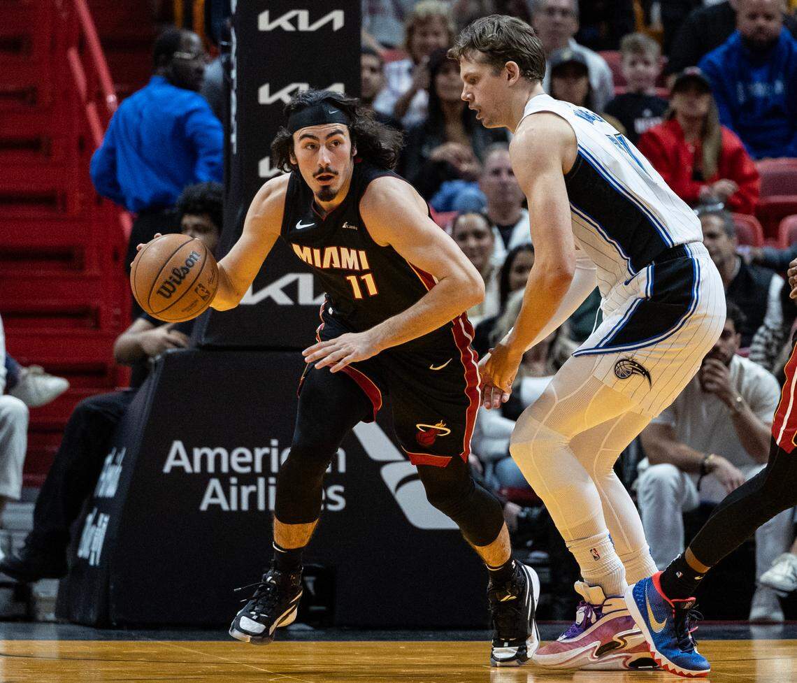 Miami Heat guard Jaime Jaquez Jr. (11) drives the ball as Orlando Magic center Moritz Wagner (21) defends in the second quarter as at the Kaseya Center in Miami, FL on Tuesday, February 6, 2024.
