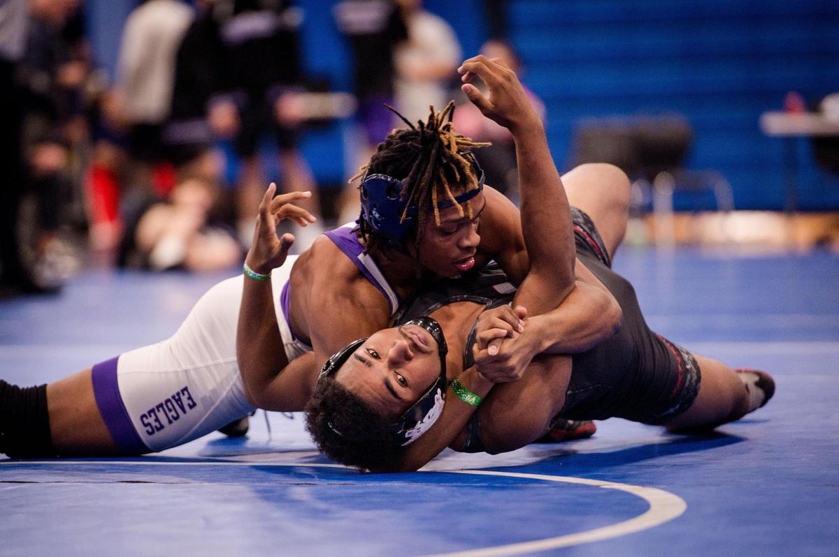 Homestead, February 3, 2024 - Willie White of Southwest Miami picks up Leonard Gilley of Miami Southridge HS during the 2024 Boys GMAC Wrestling 175 weight class championship finals at South Dade Senior High School.