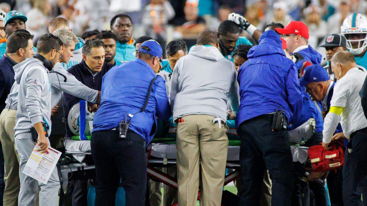 Miami Dolphins quarterback Tua Tagovailoa (1) is being transported by medical team after being sacked by Cincinnati Bengals defensive tackle Josh Tupou (68) during the second quarter of an NFL football game at Paycor Stadium on Thursday, September 29, 2022 in Cincinnati, Ohio.