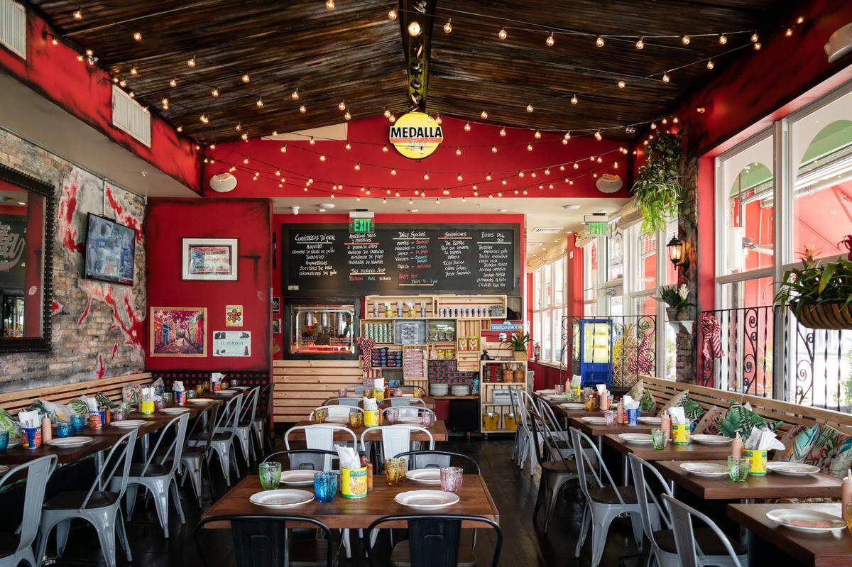 La Placita Puerto Rican restaurant will open New Year’s Day under a literal controversy. A massive mural covering the three-story building was commissioned without going through a historic board that governs the MiMo area in which it resides.
