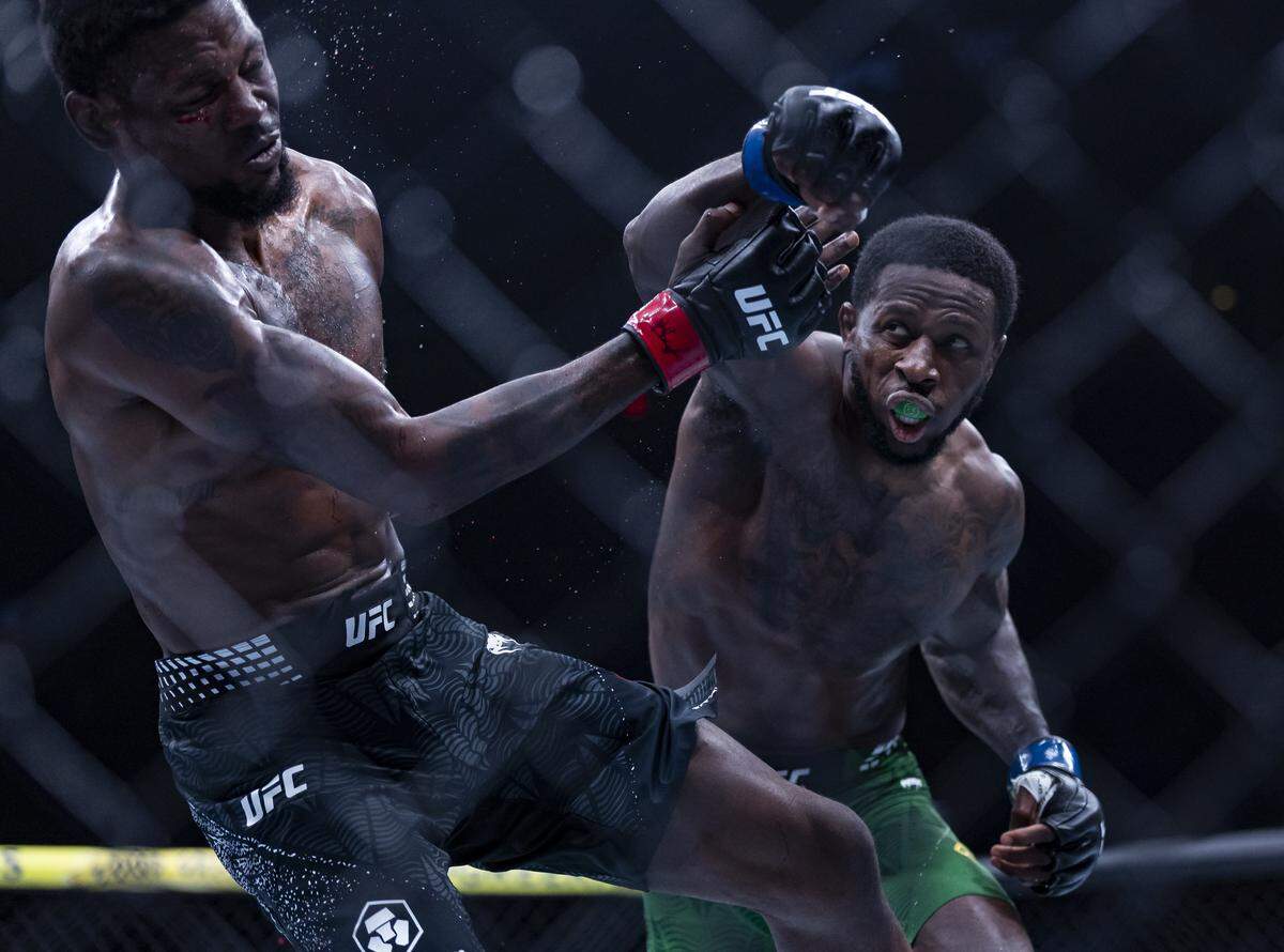 Kevin Holland of the United States and Randy Brown of Jamaica fight in their welterweight bout at UFC 327 at the Kaseya Center on Saturday, April 11, 2026, in downtown Miami, Fla.