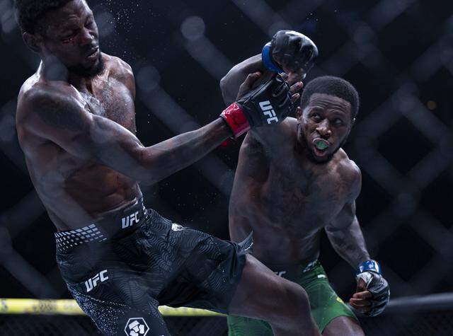 Kevin Holland of the United States and Randy Brown of Jamaica fight in their welterweight bout at UFC 327 at the Kaseya Center on Saturday, April 11, 2026, in downtown Miami, Fla.
