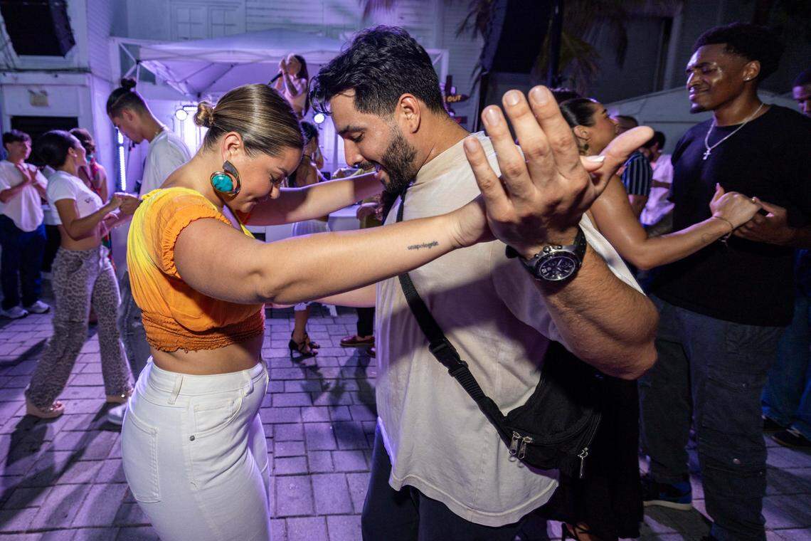 Bella, 27, left, and Andres, 31, right, work on their salsa steps at Salsa Z. 