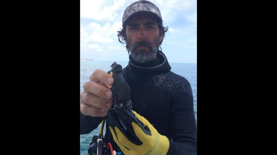 Capt. Mike Perna pulled the encrusted lion off the seafloor about 200 yards off Sebastian, Florida. It was among 60 artifacts spread across a 200-foot area, he says.