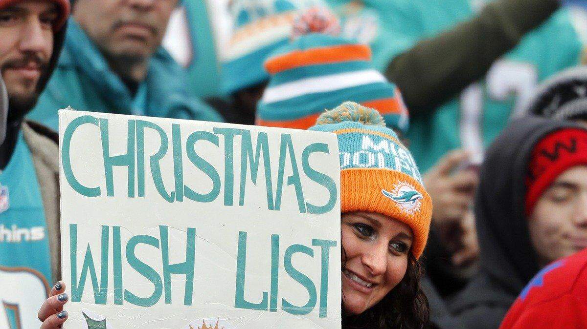 A Dolphin fan expresses her wishes as the Buffalo Bills host the Miami Dolphins at New Era Field in Orchard Park, NY on Saturday, December 24, 2016.