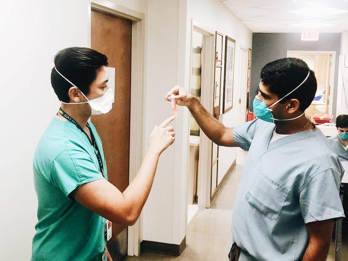 Dr. Kevin Chu, a post-graduate year five Department of Urology resident (left) at the University of Miami Miller School of Medicine, with Dr. Ranjith Ramasamy, associate professor and director of reproductive urology at UM (right). Ramasamy led a study that found COVID-19 can invade tissues in the testicles in some men who are infected with the novel coronavirus.