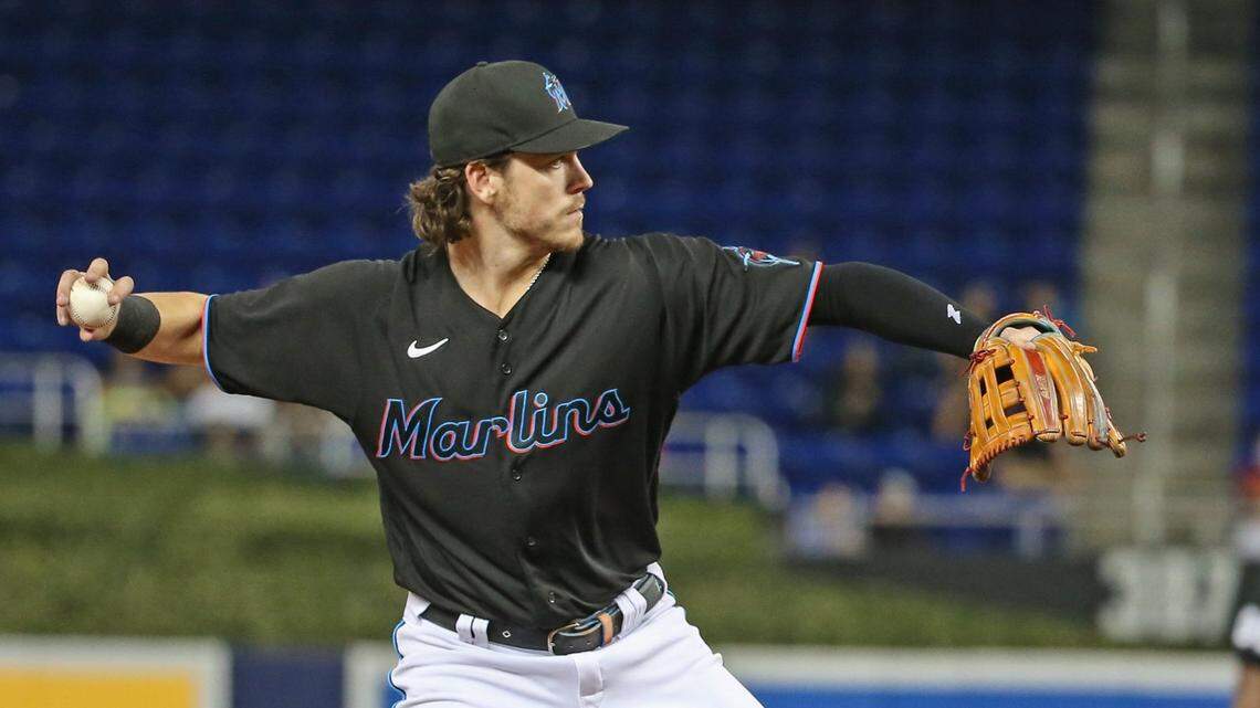 Miami Marlins third baseman Brian Anderson (15) fields the ball as the Miami Marlins host the Cincinnati Reds at loanDepot park in Miami on Friday, August 27, 2021.