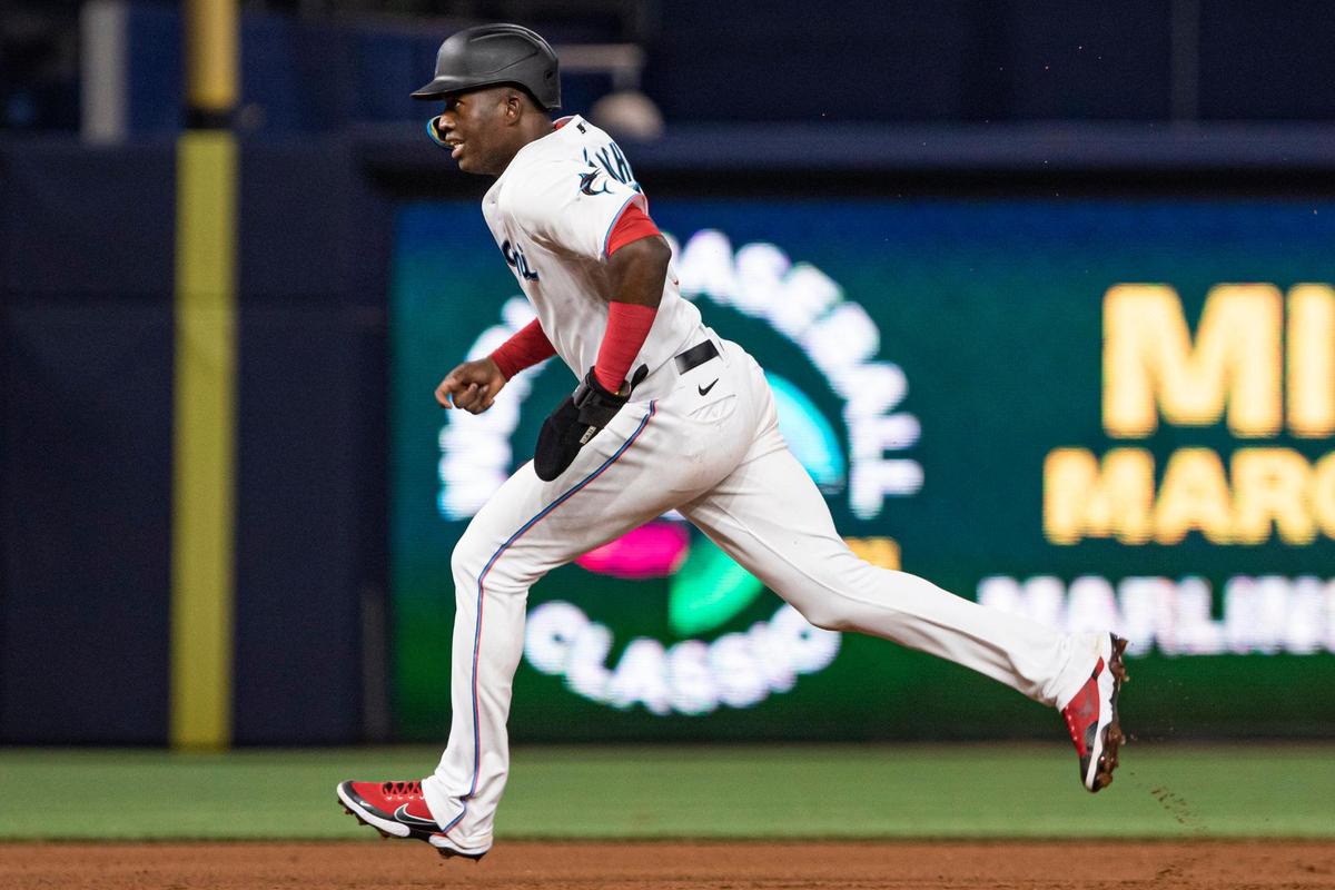 Miami Marlins center fielder Jesús Sanchez (7) runs after getting hit by pitch during the fifth inning of an MLB game against the Cincinnati Reds at loanDepot park in Miami, Florida on Monday, August 1, 2022.