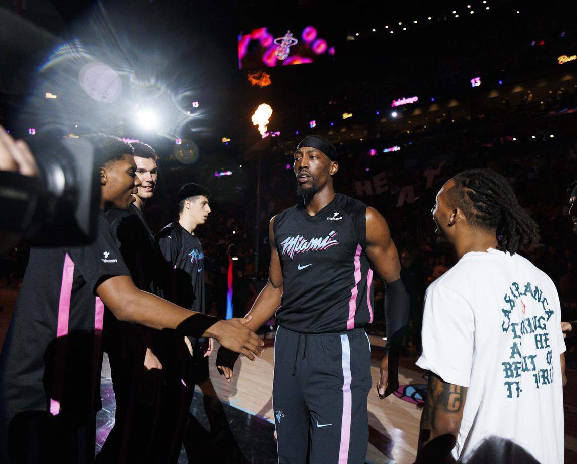 Miami Heat center Bam Adebayo (13) high fives teammates before the first half of a game on March 30, 2026, at Kaseya Center in Miami.