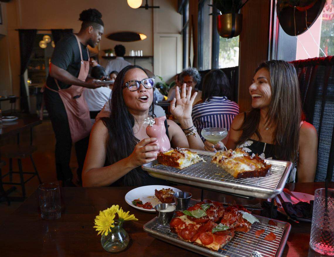 Diners enjoy pizza at Vice City Pizza in South Miami. 