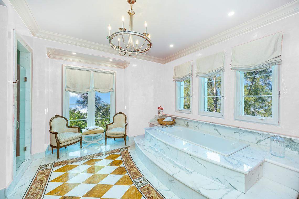 The house has eight bathrooms, one of which is pictured here, and a powder room.