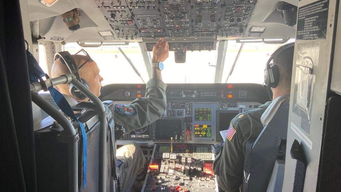 U.S. Coast Guard pilots Lt. Spencer Zwenger and Lt. Cmdr. Joshua Mitcheltree prepare their C-144 Ocean Sentry plane for a patrol over the Florida Straits Saturday, Jan. 14, 2023.