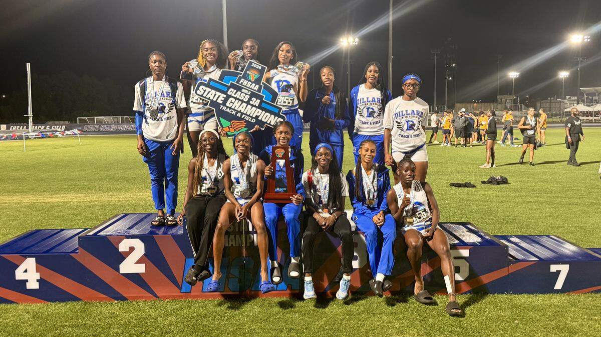 The Dillard girls’ track and field team celebrates after winning the Class 3A girls’ team state championship on Friday at the University of North Florida in Jacksonville, Fla.
