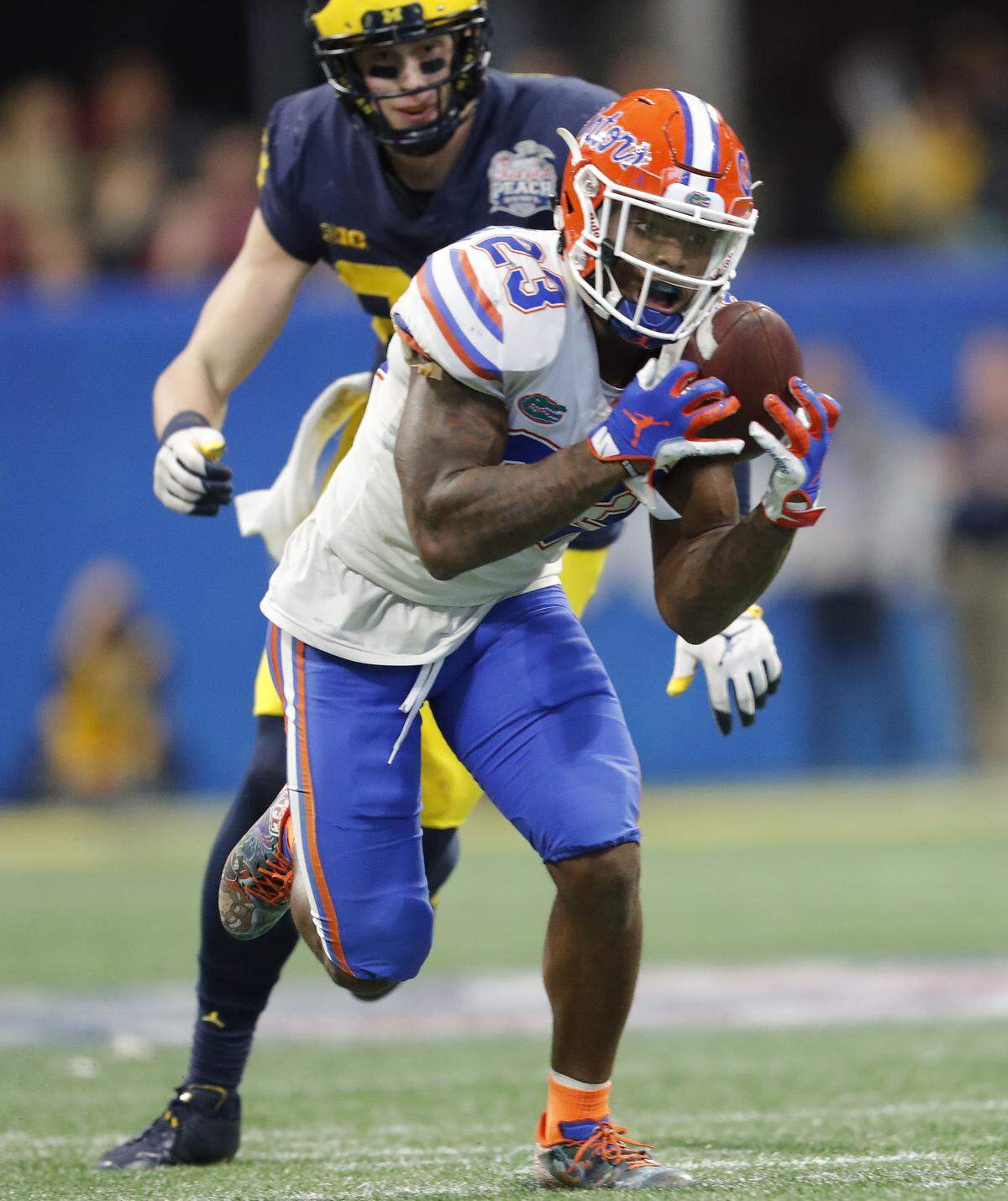 Florida defensive back Chauncey Gardner-Johnson (23) makes the catch against Michigan during the second half of the Peach Bowl NCAA college football game, Saturday, Dec. 29, 2018, in Atlanta. Florida won 41-15. (AP Photo/John Bazemore)