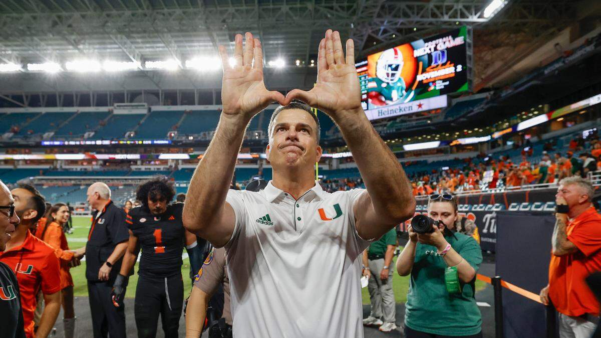 Miami Hurricanes head coach Mario Cristobal flashes the U after the Canes defeat the Florida State Seminoles during an NCAA football game at Hard Rock Stadium in Miami Garden, Florida on Saturday, October 26, 2024.