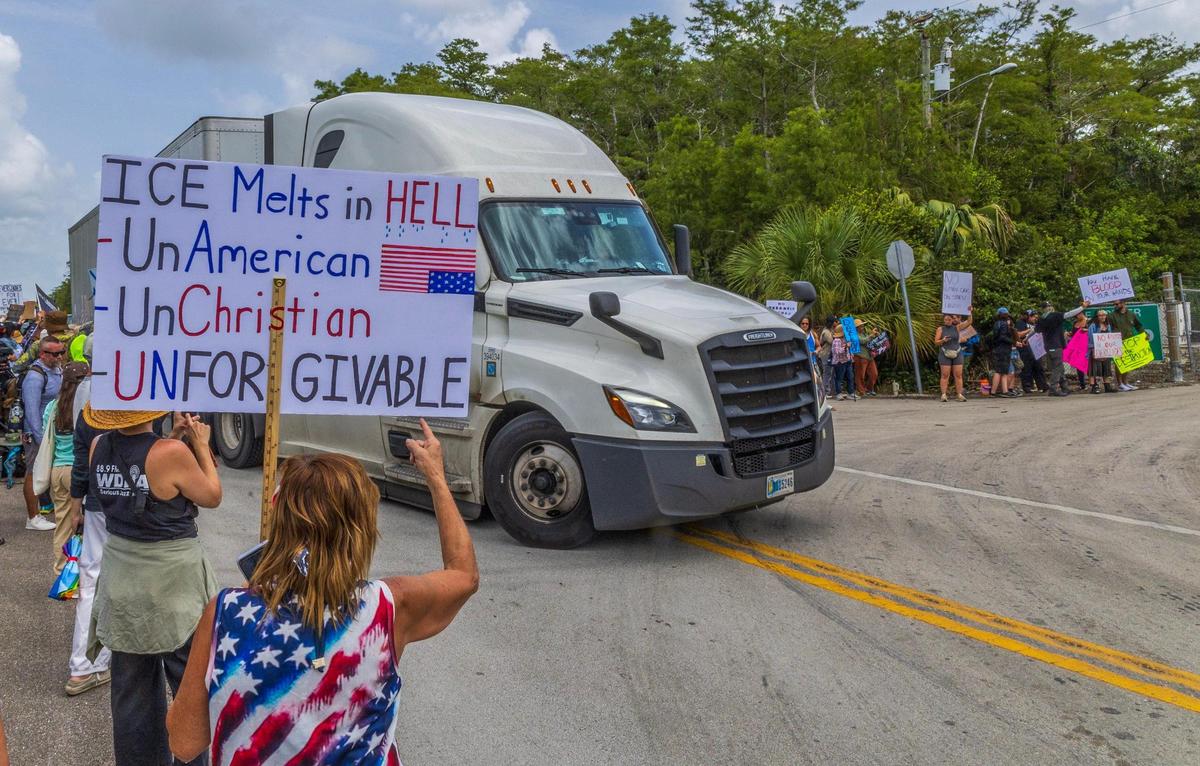 Protesters shouted to trucks entering the Dade-Collier Training and Transition Airport during the “Stop Alligator Alcatraz” protest in opposition to the construction of a massive detention facility for undocumented immigrants on the site, which is in the middle of the Florida Everglades, in Ochopee, Florida, on Saturday June 28, 2025.