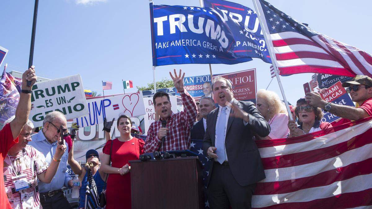 U.S. Rep. Matt Gaetz, center, demands an end to the impeachment inquiry against President Donald Trump Friday, outside Democratic U.S. Rep. Donna Shalala’s Kendall office.