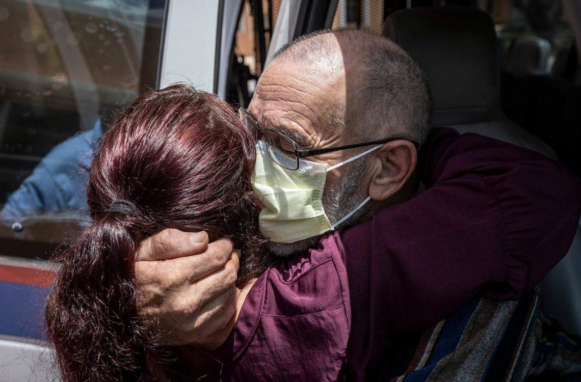Dale Silvia, right, hugs social services director Sami Rudnick-Hoover, LCSW, in the van that will take him to an assisted living facility in Wynwood on Monday, June 21, 2021.