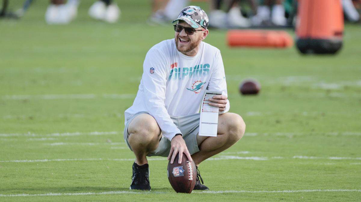Miami Dolphins quarterbacks and passing game coordinator Darrell Bevell holds the football during practice at Baptist Health Training Complex in Miami Gardens on Wednesday, November 23, 2022.