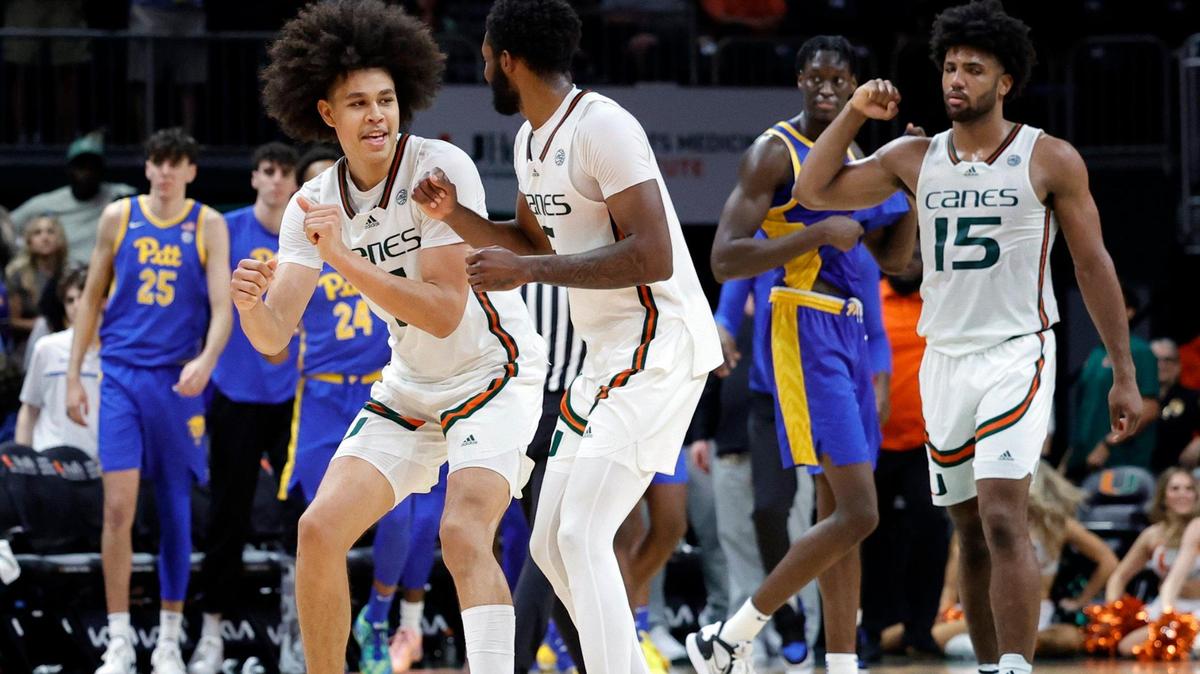 Miami Hurricanes guard Kyshawn George (7), guard Wooga Poplar (5) and forward Norchad Omier (15) celebrate as the Canes defeat Pittsburgh Panthers at the Watsco Center in Coral Gables, Florida on Saturday, January 27, 2024.