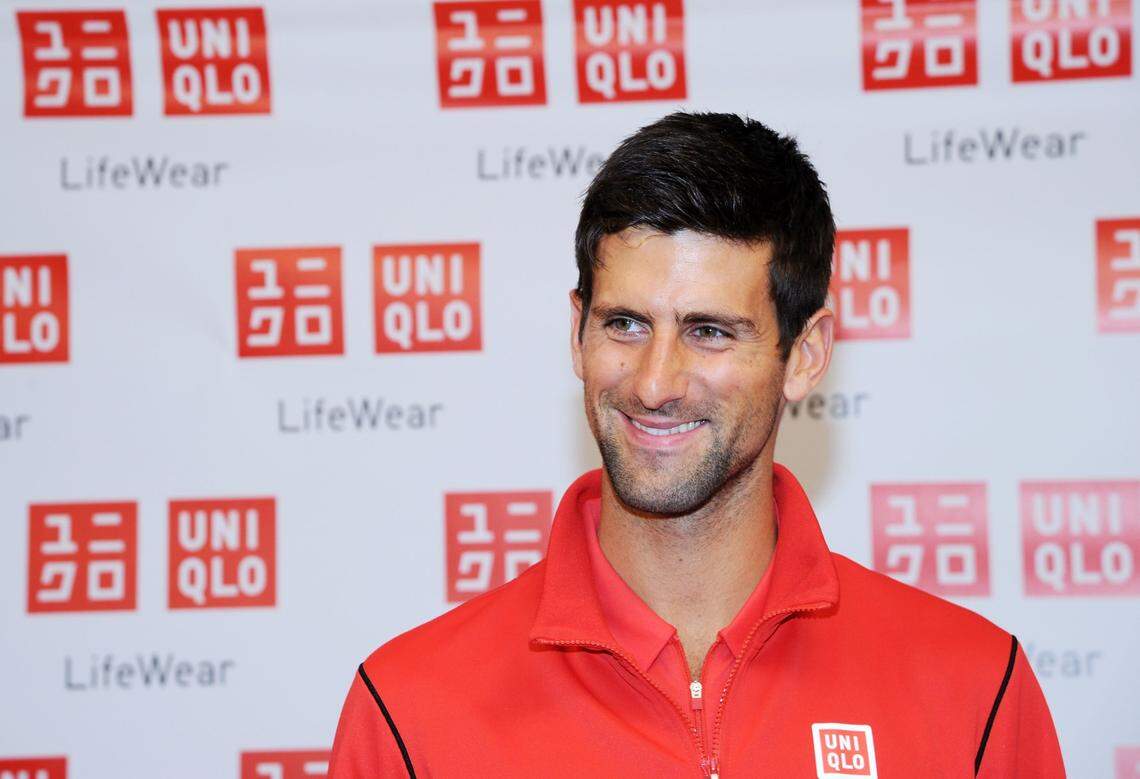 Tennis pro Novak Djokovic visits the Uniqlo New York Fifth Avenue global flagship store on Aug. 19, 2013, in New York City.