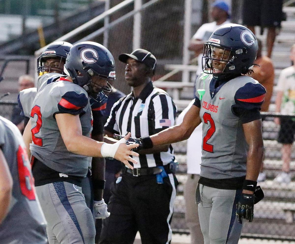 Columbus Explorers Bryce Fitzgerald (on the right) celebrates a touchdown against South Dade Buccaneers during football game on Saturday, September 28, 2024 at Harris Field Park in Homestead. Andrew Uloza / for Miami Herald