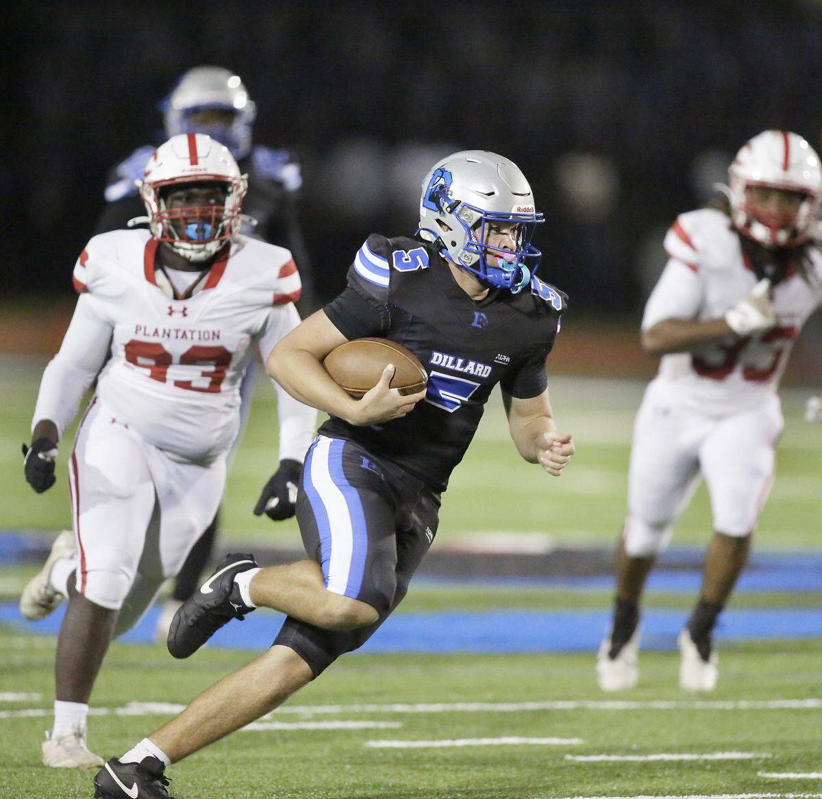 Dillard Panthers quarterback Jayden Chico (5) carries the ball against Plantation Colonels during Region 4-4A quarterfinal football game on Friday, November 14, 2025 at Otis Gray Jr. Memorial Stadium in Fort Lauderdale. Andrew Uloza / for Miami Herald