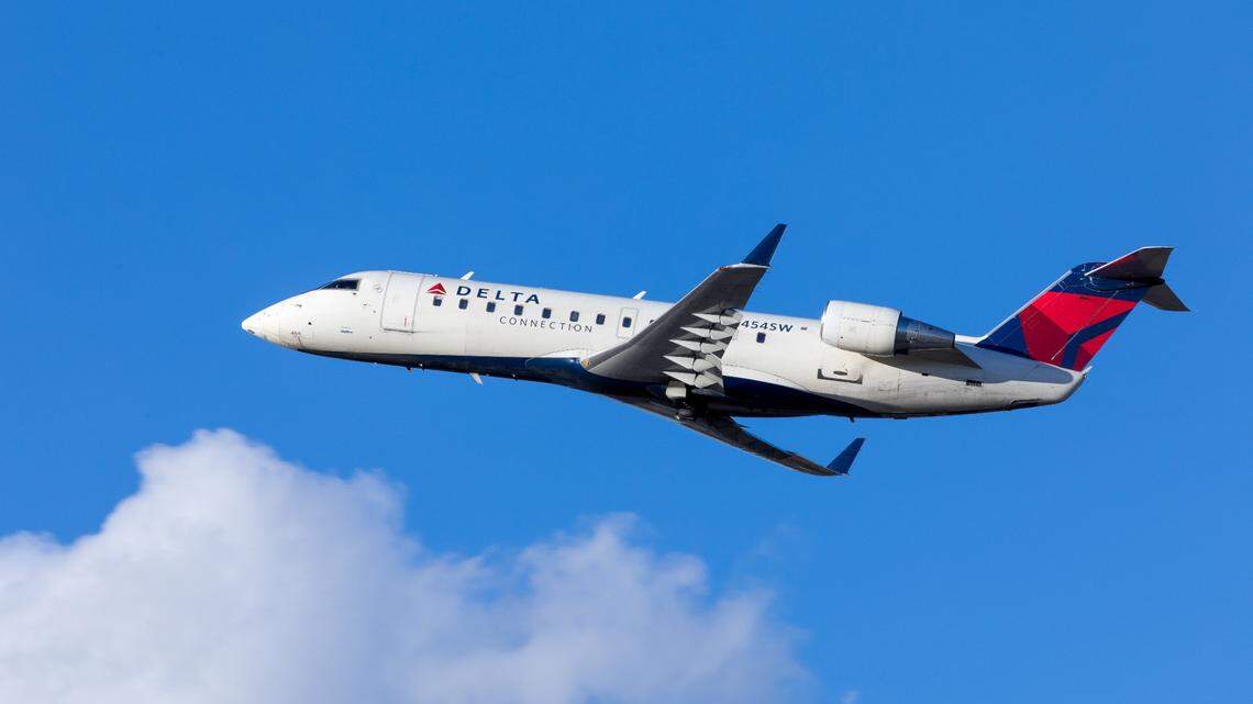 A Delta Air Lines passenger groped a teenager on a flight from Atlanta to Seattle and was arrested after the plane landed, federal prosecutors say.