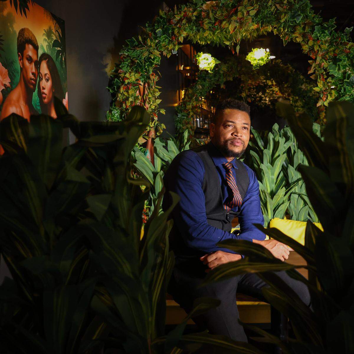 Eddy Aitah, a Nigerian national who operates the Broward African restaurant, “Eden,” with his wife, is photographed in one of the booths on Wednesday, September 10, 2025, in West Park, Florida.