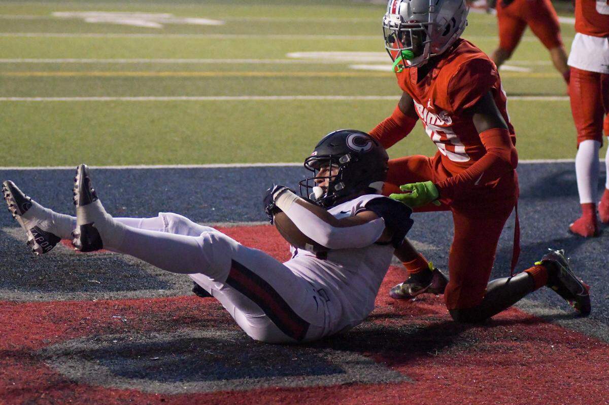 Miami Columbus wide receiver JJ Gomez catches a first-quarter touchdown in a game against Doral Academy on Friday, Oct. 14, 2022, at Doral Academy.