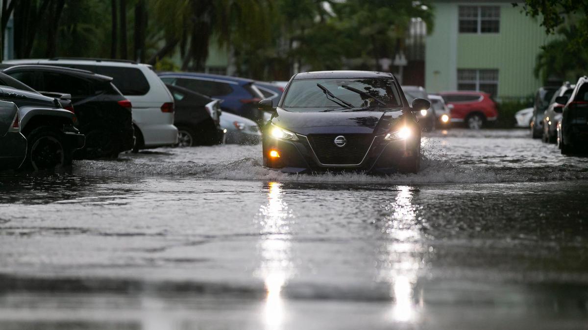 Cars approach Harding Avenue on 86th Street in Surfside as heavy rain and thunderstorms made their way across South Florida on Monday, July 12, 2021. South Florida’s high humidity levels require taking care of your skin to prevent certain skin issues.