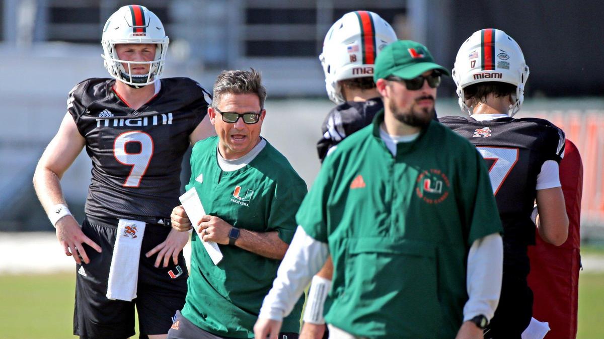 Miami Hurricanes offensive coordinator Shannon Dawson works with the quarterbacks during practice at the University of Miami’s Greentree Field on Tuesday, March 7, 2023.