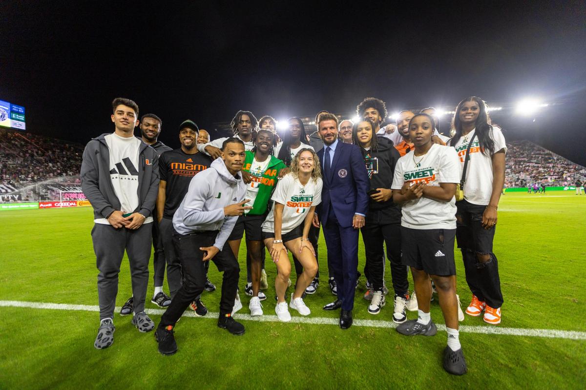 University of Miami Men’s and Women’s Basketball team take a photo with David Beckham at halftime during an MLS soccer game between Inter Miami CF and FC Dallas at DRV PNK Stadium in Fort Lauderdale, Florida, on Saturday, April 8, 2023.
