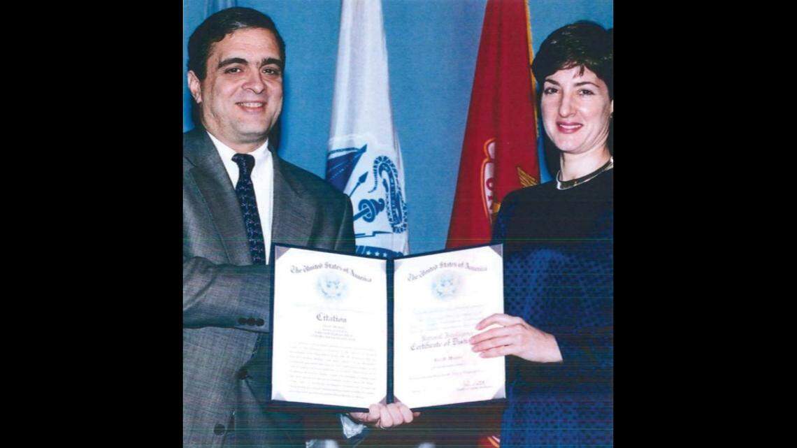 Ana Belén Montes receives the National Intelligence Certificate of Distinction from then-deputy Director of Central Intelligence George Tenet on Feb. 21, 1997.
