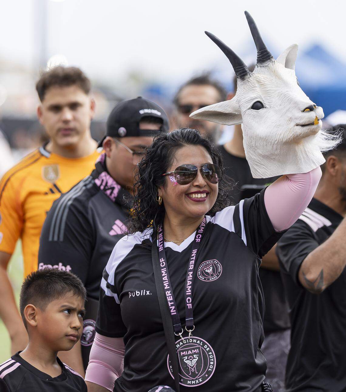 A fan holds a goat mask as she waits to enter Nu Stadium in Miami Freedom Park before an MLS match between Inter Miami CF and Austin FC on Saturday, April 4, 2026, in Miami, Fla.