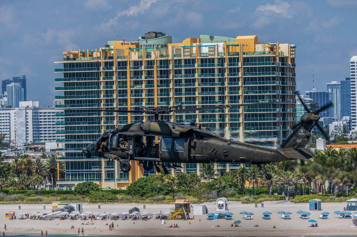 A UH-60 Black Hawk from the 8-229th Assault Helicopter Battalion, based at Fort Knox, Kentucky, flies over South Beach during a rehearsal for the Hyundai Air & Sea Show, part of the annual National Salute to America’s Heroes, in Miami Beach on Friday, May 23, 2025.