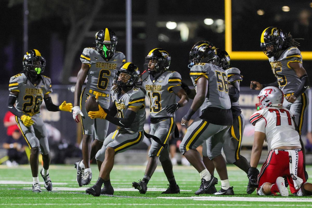 American Heritage outside linebacker Omar Thornton (0) celebrates after intercepting the football against the St. John’s Cadets during the third quarter of a high school football game at American Heritage School in Plantation, Florida on Saturday, August 26, 2023.
