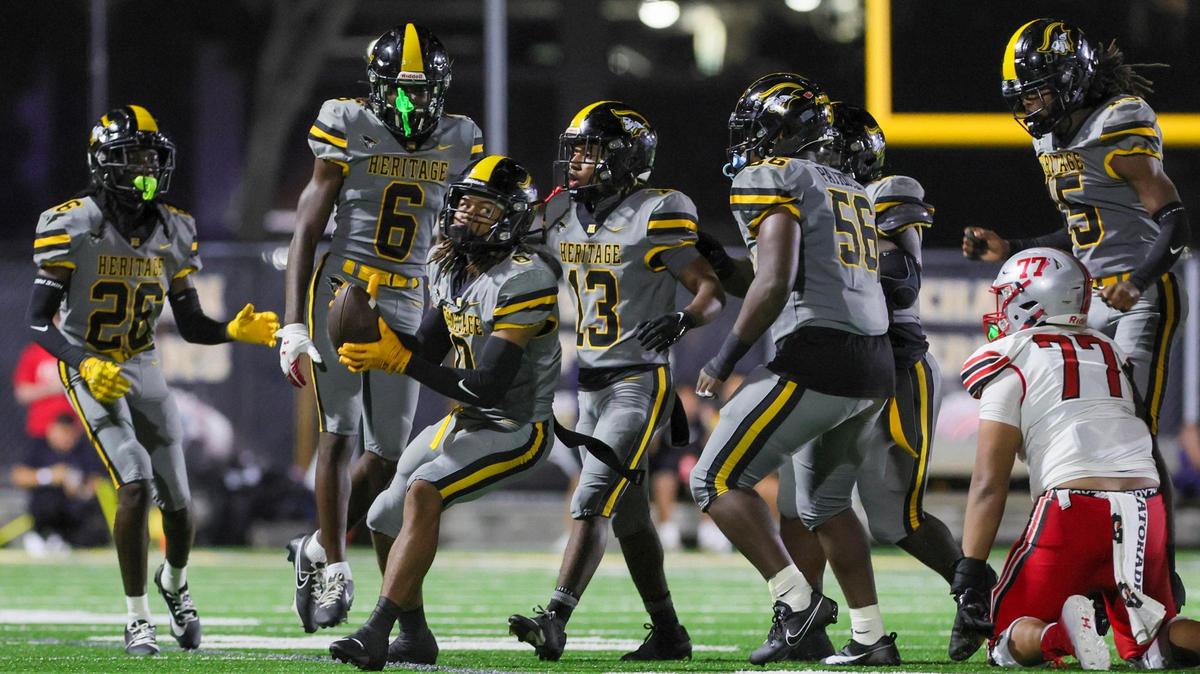 American Heritage outside linebacker Omar Thornton (0) celebrates after intercepting the football against the St. John’s Cadets during the third quarter of a high school football game at American Heritage School in Plantation, Florida on Saturday, August 26, 2023.