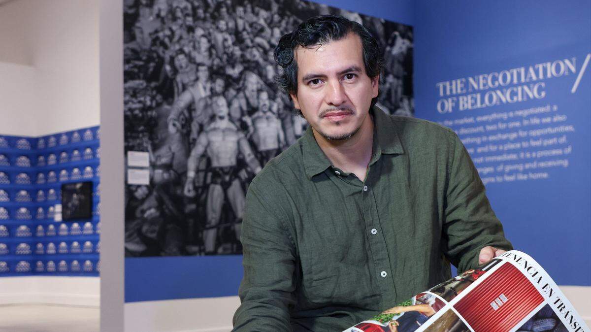 Carlos “Cali” Muñoz, a photographer who received a 2023 grant from HistoryMiami to document the Redland Market in Homestead, is photographed in his exhibition exploring the lives of market workers in Homestead at HistoryMiami on Thursday, December 18, 2025, in Miami, Florida.