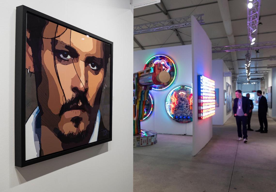 Johnny Depp’s “Buy The Ticket, Take The Ride” is on display during a VIP preview at Art Miami.