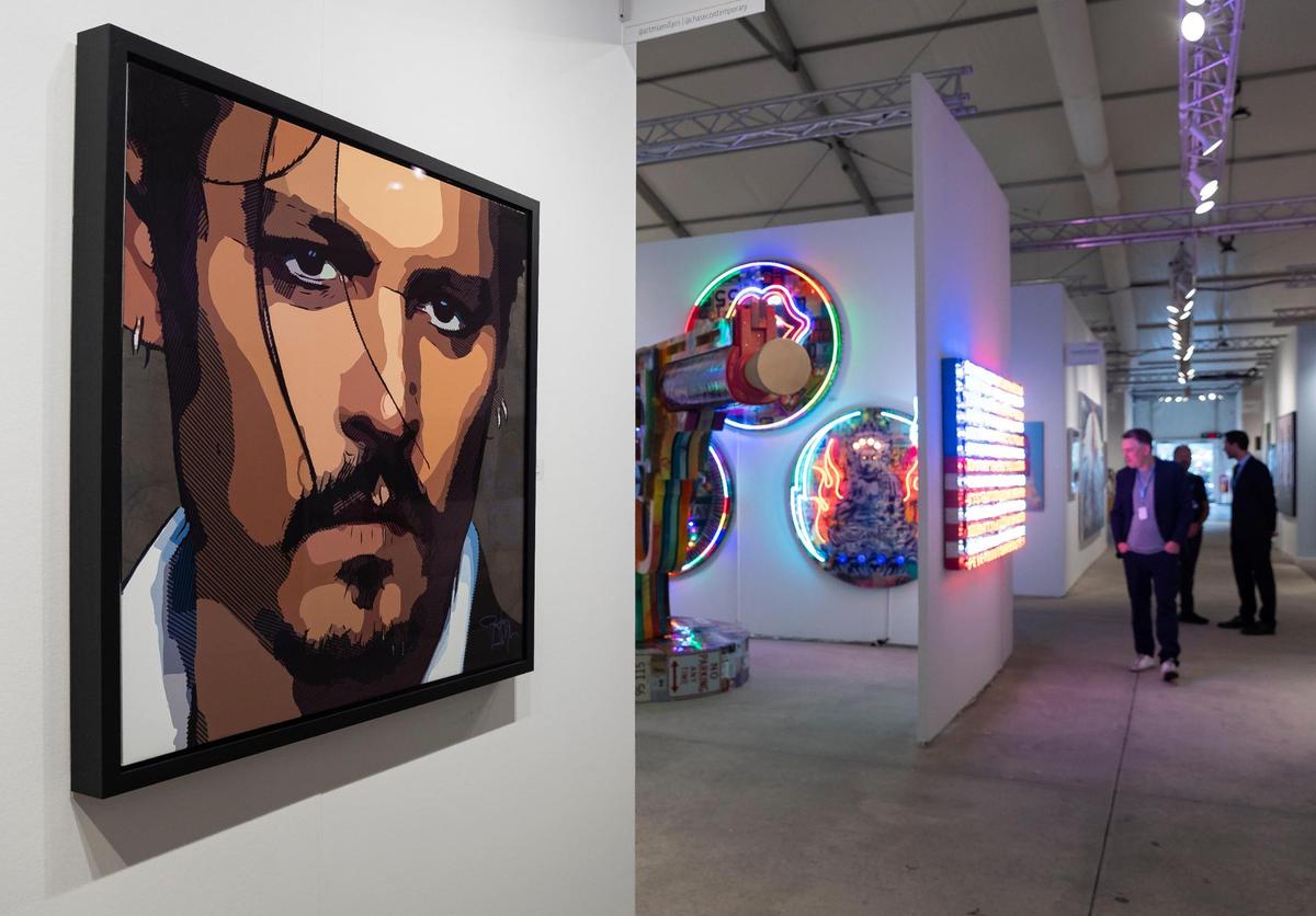 Johnny Depp’s “Buy The Ticket, Take The Ride” is on display during a VIP preview at Art Miami 2023 on Tuesday, Dec. 5, 2023, in downtown Miami, Fla.