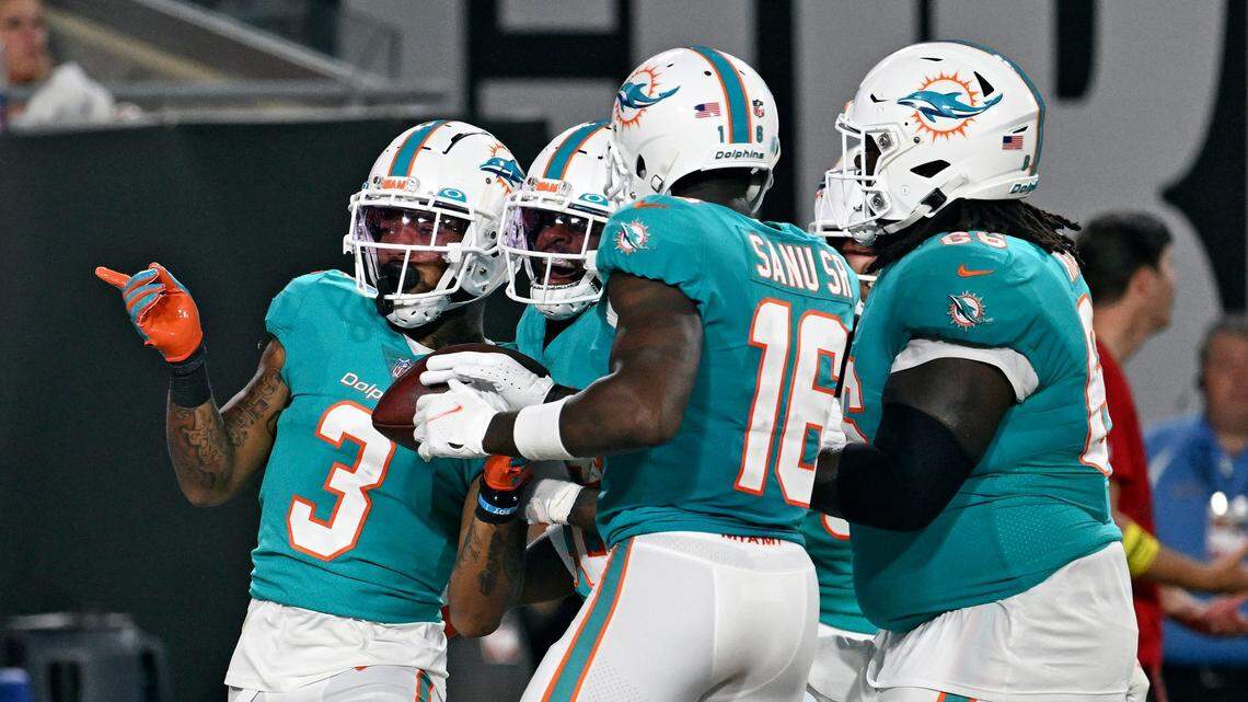Miami Dolphins wide receiver Lynn Bowden Jr. (3) celebrates his touchdown against the Tampa Bay Buccaneers with teammates, including wide receiver Mohamed Sanu (16) during the first half of an NFL preseason football game Saturday, Aug. 13, 2022, in Tampa, Fla. (AP Photo/Jason Behnken)